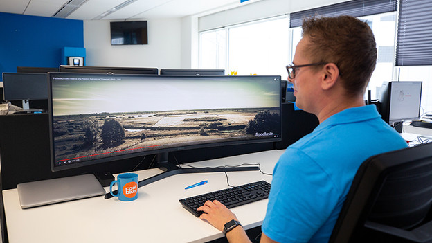 Expert working with an ultrawide monitor