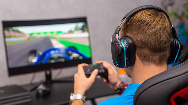 Gaming on PlayStation 4 with headset.