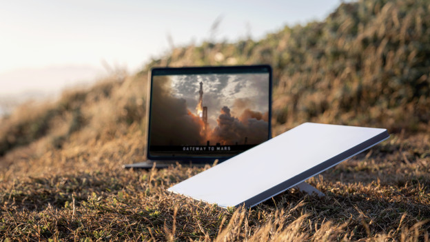 Starlink Mini in a field with laptop