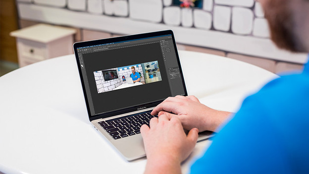 Expert uses Photoshop on Apple MacBook