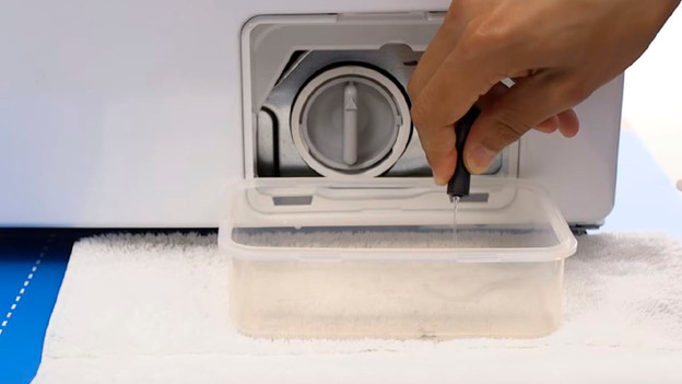 Empty washing machine drain filter