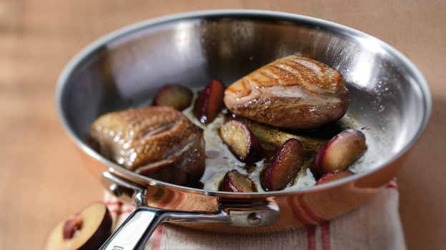 Meat and fruit in pan without non-stick coating