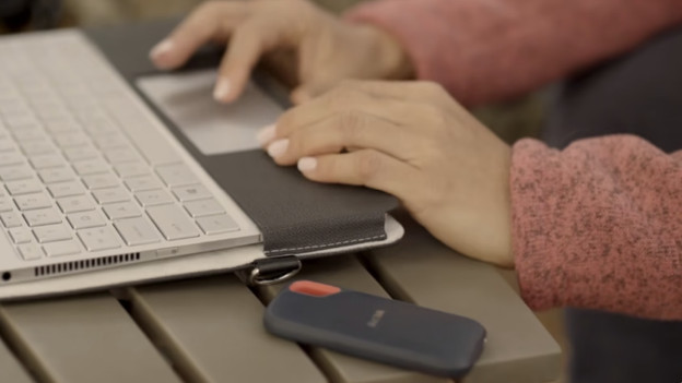 SanDisk SSD next to a laptop