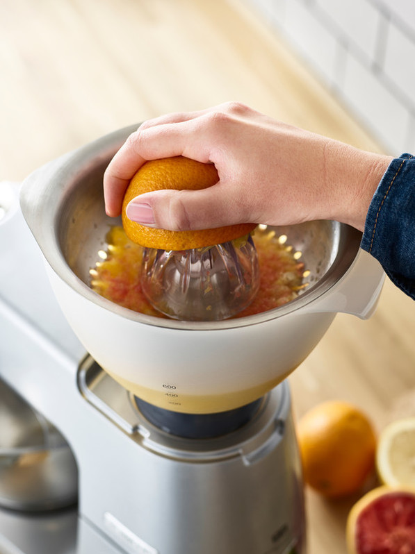 Kenwood AT312 Citrus Press product in use