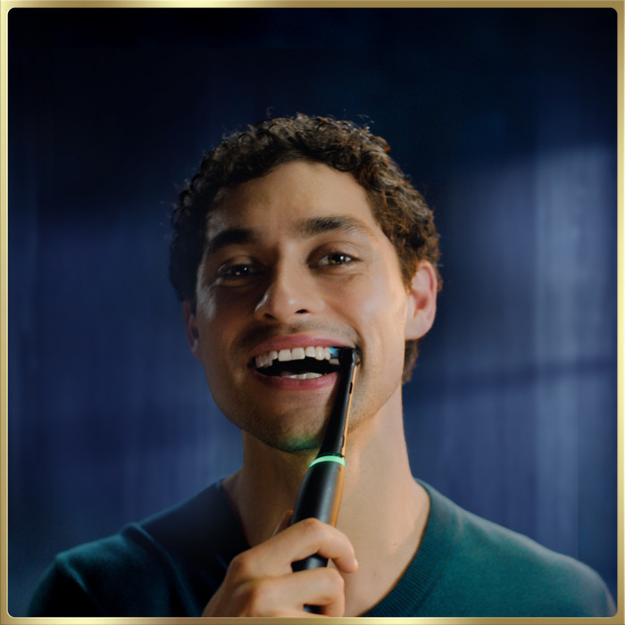 Oral-B iO 9N Black with Extra Brush Attachment product in use