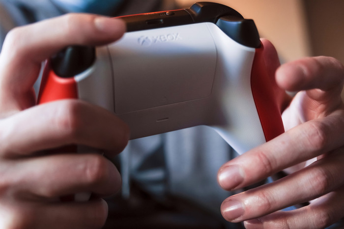 Microsoft Xbox Series X and S Wireless Controller Red product in use