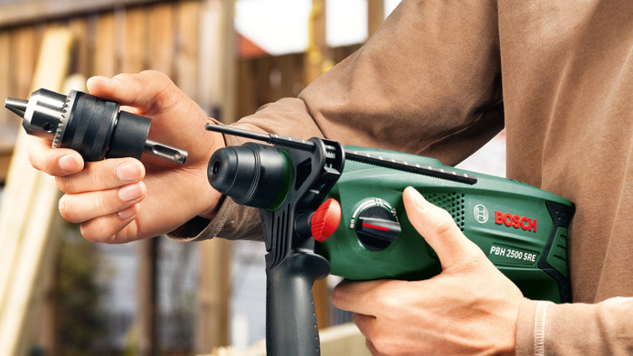 Bosch PBH 2500 SRE + 6-piece SDS Plus Drill Bit Set product in use