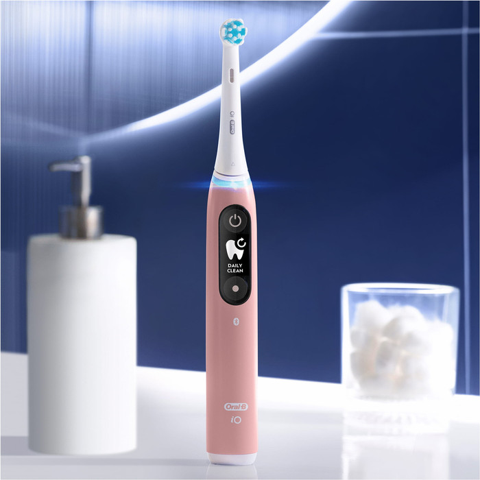 Oral-B iO Series 6N Light Pink + Extra iO Gentle Care Brush Attachment product in use
