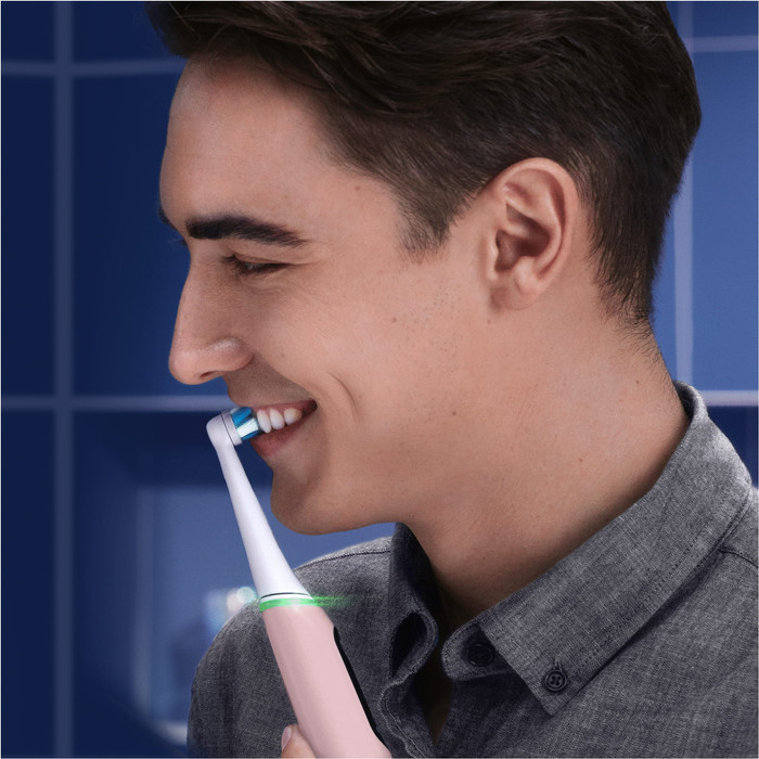 Oral-B iO Series 6N Light Pink + Extra iO Gentle Care Brush Attachment product in use