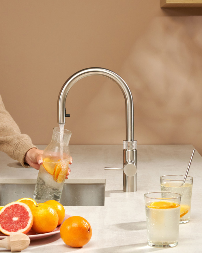 Quooker COMBI+ and Quooker Flex Round Stainless Steel and Quooker CUBE product in use