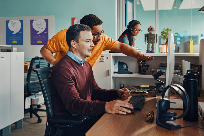 Poly Voyager Focus 2 UC Office Headset + Charging Dock product in use