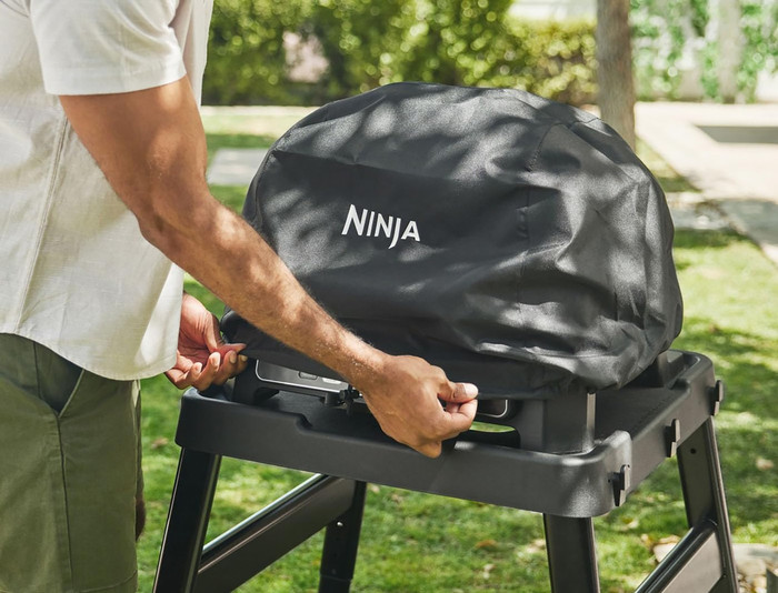 Ninja Woodfire Electric BBQ Grill and Smoker OG850EU Starter Pack product in use