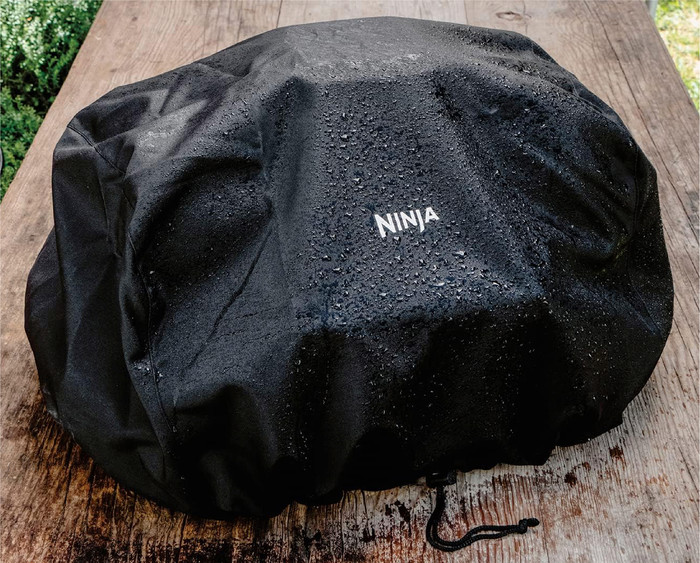 Ninja Woodfire Electric BBQ Grill and Smoker OG850EU Starter Pack product in use