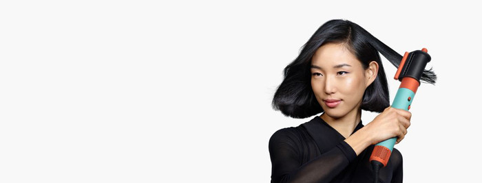 Dyson Airwrap i.d. Curly + Coily Red Velvet/Gold product in use