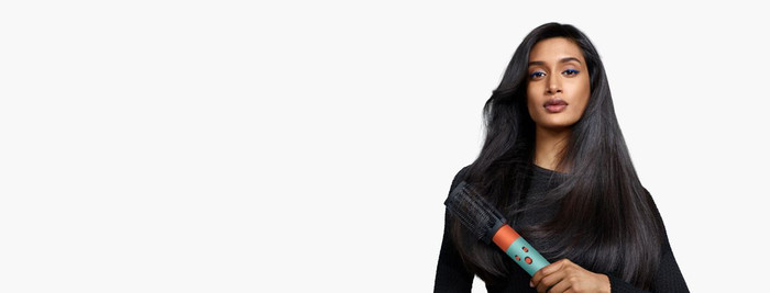 Dyson Airwrap i.d. Curly + Coily Red Velvet/Gold product in use