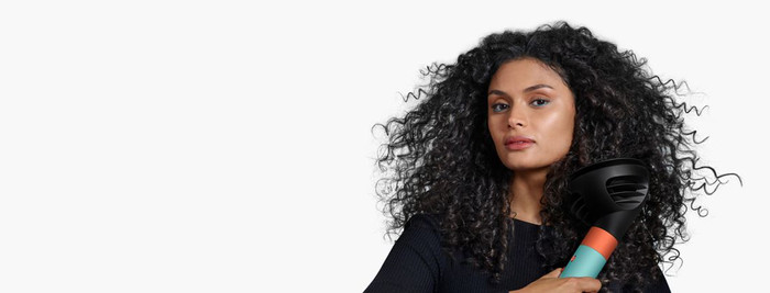 Dyson Airwrap i.d. Curly + Coily Red Velvet/Gold product in use