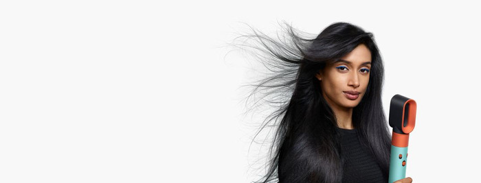 Dyson Airwrap i.d. Curly + Coily Red Velvet/Gold product in use