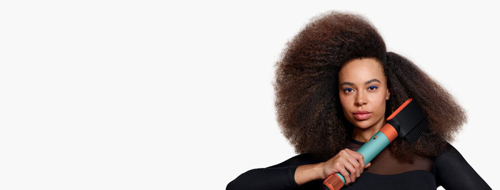 Dyson Airwrap i.d. Curly + Coily Red Velvet/Gold product in use