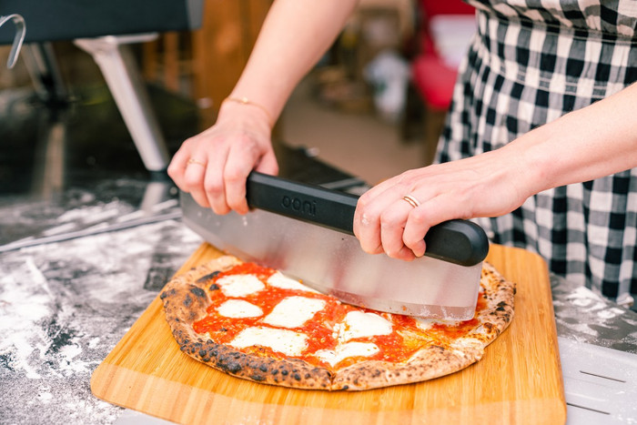 Ooni Pizza Cutter Rocker Blade product in use