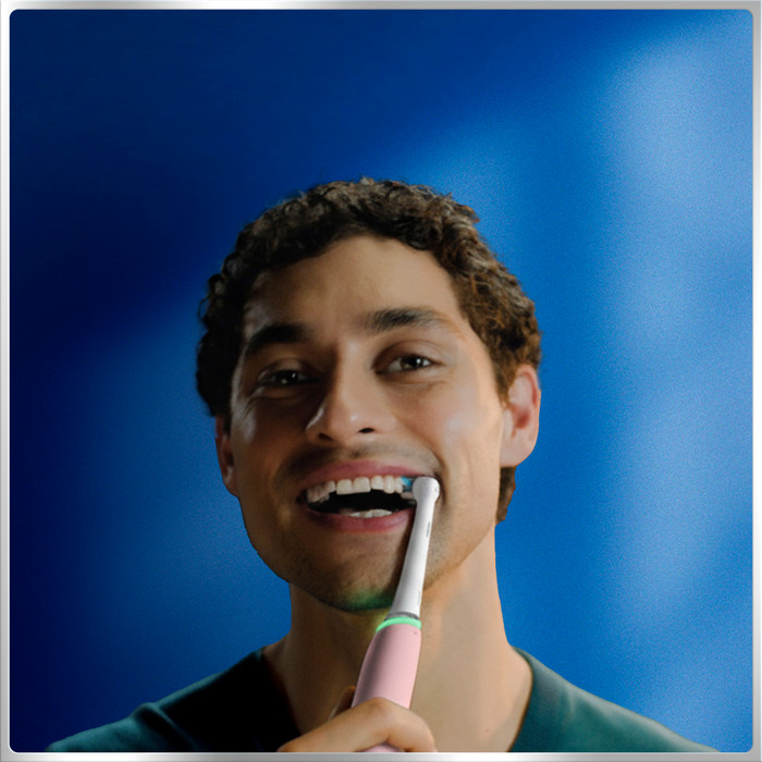 Oral-B iO Series 6N Light Pink + Extra iO Gentle Care Brush Attachment product in use