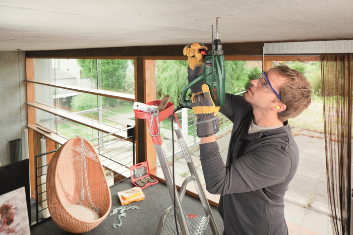 Bosch PBH 2100 RE + 6-piece SDS Plus Drill Bit Set product in use