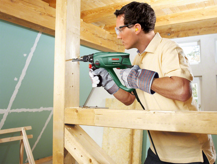 Bosch PBH 2500 SRE + 6-piece SDS Plus Drill Bit Set product in use