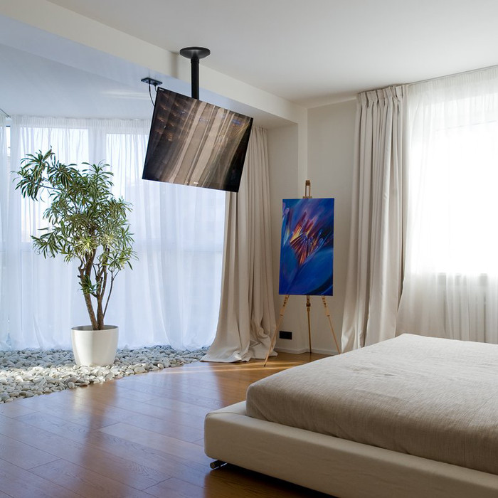 Neomounts FPMA-C060BLACK TV Plafondsteun Zwart product in gebruik
