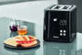 Tefal Smart & Light TT6408 Toaster product in use