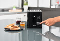 Tefal Smart & Light TT6408 Toaster product in use