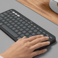 Logitech Pebble Keyboard 2 - K380s Graphite QWERTY product in use