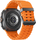 Samsung Galaxy Watch Ultra 4G Grijs/Oranje 47mm + Duo Draadloze Oplader achterkant