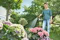 Karcher Slanghaspel HR 3.20 Set + Karcher Premium Multifunctioneel Spuitpistool product in gebruik