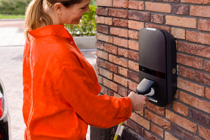 Woman by charging station