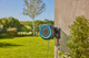Gardena Wandslangenbox PowerRoll XL P4A Set + Premium Broes Metaal product in gebruik