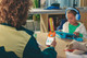 JBL JR470NC Blue + Charger product in use