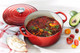 Le Creuset Signature Round Dutch Oven 24cm Cerise product in use